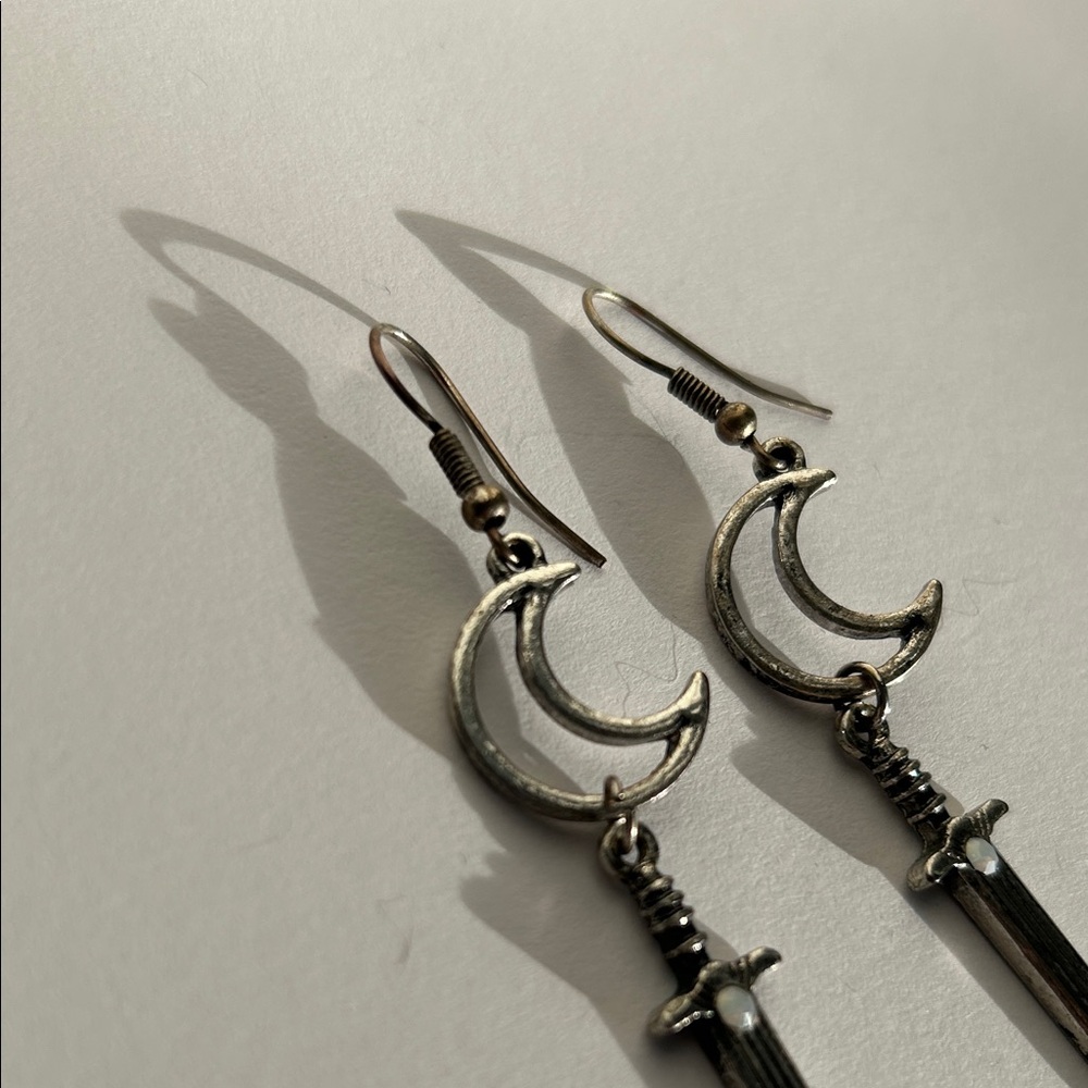 Silver tone Crescent moon and Sword drop Earrings with faux moonstone - Picture 2 of 3